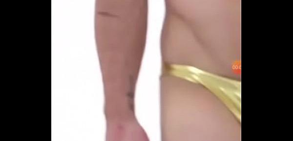  Guy in metallic golden bikini